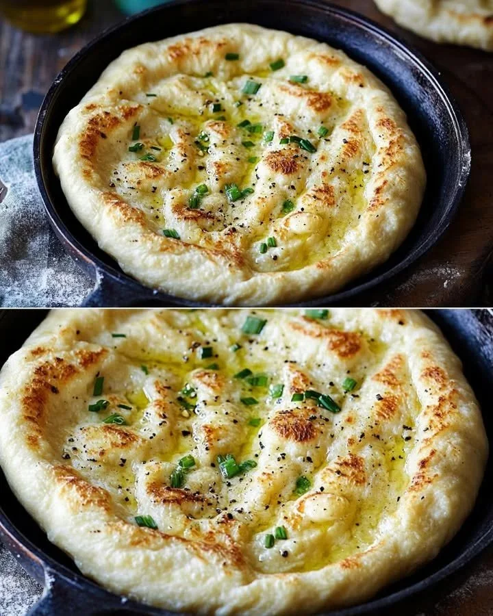 Naan all'aglio fresco servito con erbe aromatiche e burro fuso.